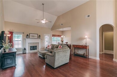 Living Room – 23x16 with Hardwood Floors, 14 foot Vaulted Ceiling, 