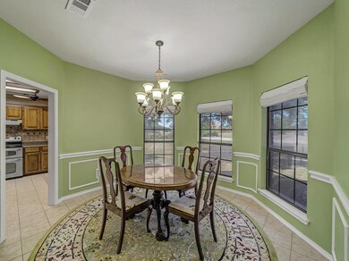 Dining room with light tile patterned floors and c