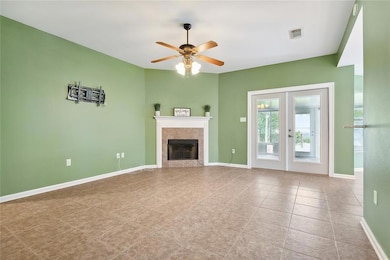Electric fireplace with doors going to sunroom