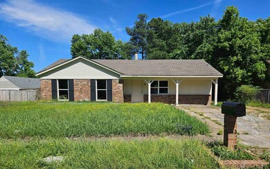 Ranch-style home featuring brick siding