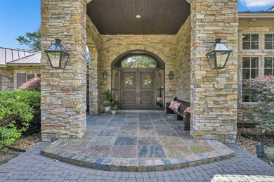 Step onto the inviting covered front porch, featur