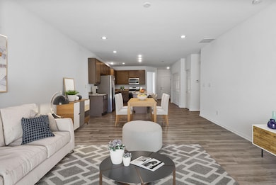 Camelia_ staged great room from back doo