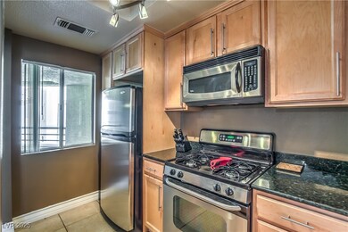 Kitchen with stainless steel appliances, light til