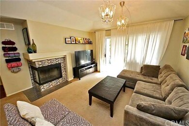 Enjoy the raised hearth fireplace with glass tile 