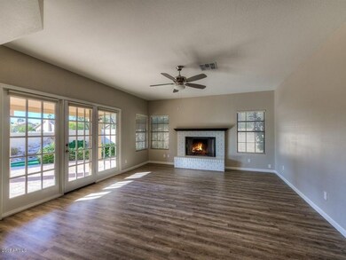 Family Room w/Fireplace & French Drs