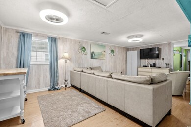 Living room featuring light hardwood / wood-style 