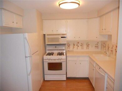 Updated kitchen with beautiful corian counters and