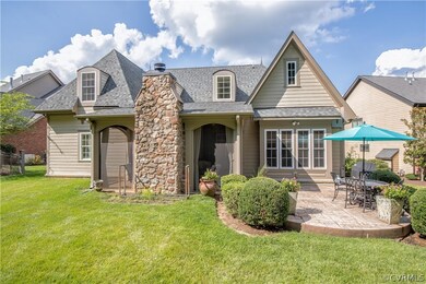 The screened porch is so gorgeous with its stone f