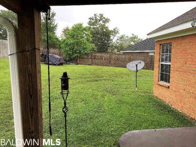 Covered patio overlooking the back yard!