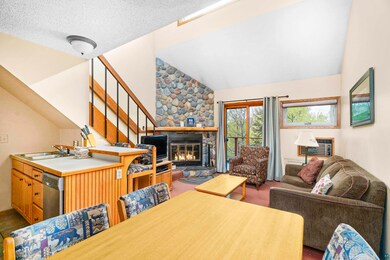 Dining room featuring high vaulted ceiling, a text