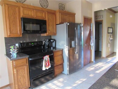 Kitchen is light and cheery complete with electric