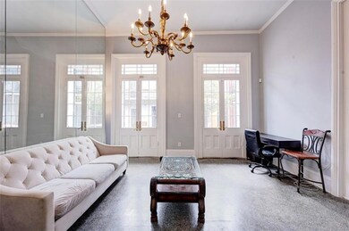 Large living room with 2 sets of French doors that