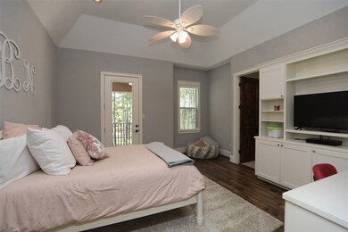Secondary bedroom, wood floors and  balcony access