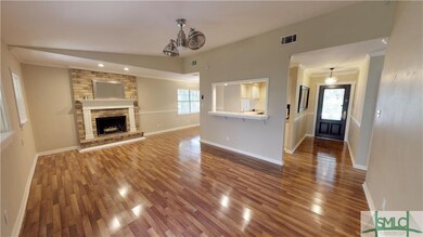 Open floor plan. Wood floors. Fireplace. New fixtu