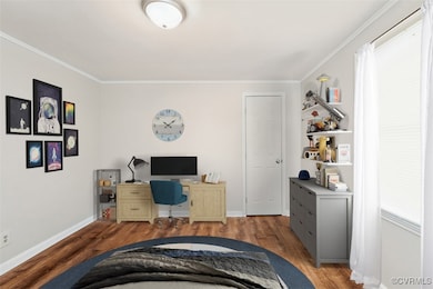 Home office featuring wood finished floors, crown