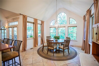 Dining Room adorned with large windows and natural light.