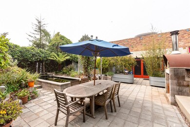 Common area has pizza oven, koi pond