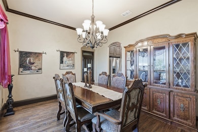 FORMAL DINING IS SPACIOUS AND OPENS INTO KITCHEN