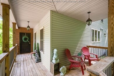 Spacious front porch with views of the front and s