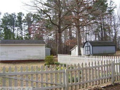 Outbuilding. Fence and storage buildings