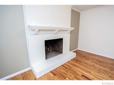 Wood burning fireplace with mantle.