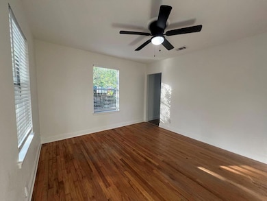 Empty room with dark wood finished floors and cei