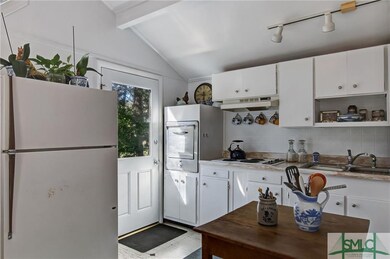 Eat-in kitchen with vaulted ceilings