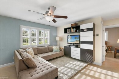 Living room with light wood-type flooring and ceil