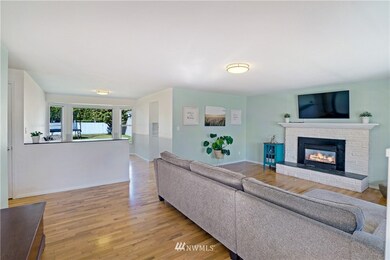 Sop bright and open. View from front door.  NOTE: half wall can be removed and sits on top of hardwood floor.