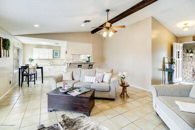 Living room view to foyer and kitchen