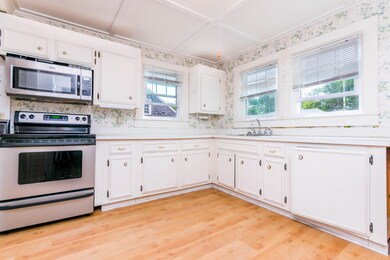 White kitchen with stainless appliances