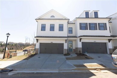 The Stockton has a front entry 2 car garage and a covered front stoop. Homesite 159 is NOT an end unit. This photo is for representation only.