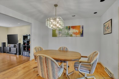 Large dining room open to family room, and slider to the rear deck
