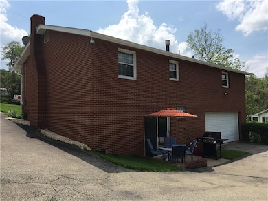 Walk out concrete patio and a two car garage.