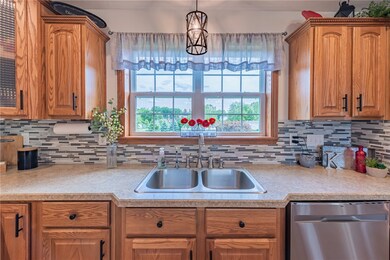 Imagine yourself doing dishes here looking out at your beautiful patio area and backyard.