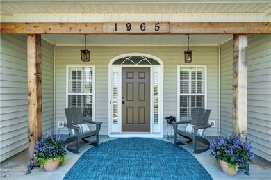 Doorway to property with covered porch