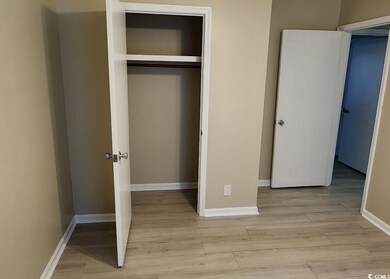 Unfurnished bedroom with light wood-type flooring and a closet