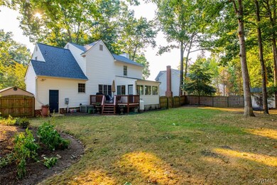 Rear Elevation, large fenced in yard w/ deck and d