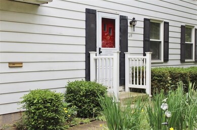 Newer railings and a bright front door.  Painted w