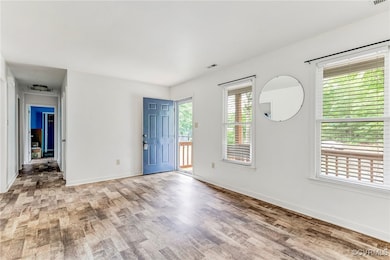 Unfurnished room featuring light wood finished flo