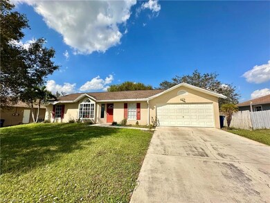 Ranch-style house featuring a garage and a front l