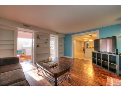 Spacious living room with new floors, built-in she
