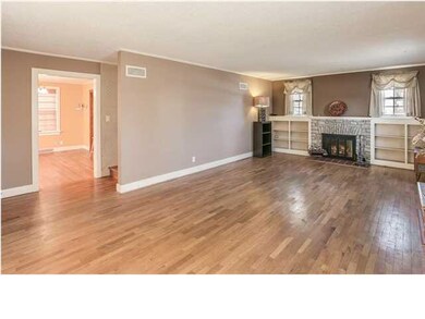 Decorative fireplace with one entire wall of built