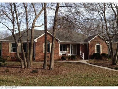 Exterior Front. Front view...showing new shutter and front door color.