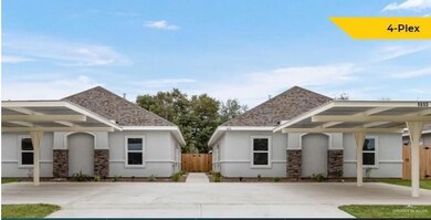 View of front of home with stucco siding, fence, and stone siding