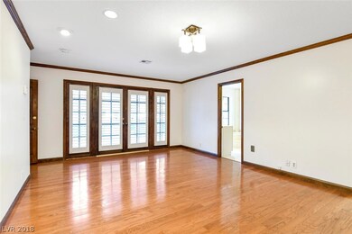 Master bedroom with doors to patio