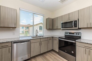 Kitchen with a sink, appliances with stainless st
