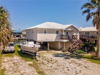 Street view of house with a water view, stairway, 