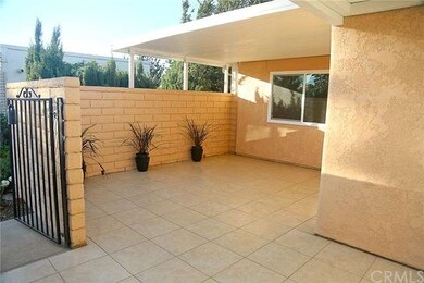 Large tiled patio with partial cover