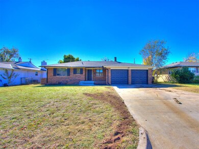Single story home featuring a garage and a front l